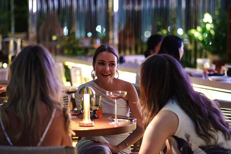 women having some food around table